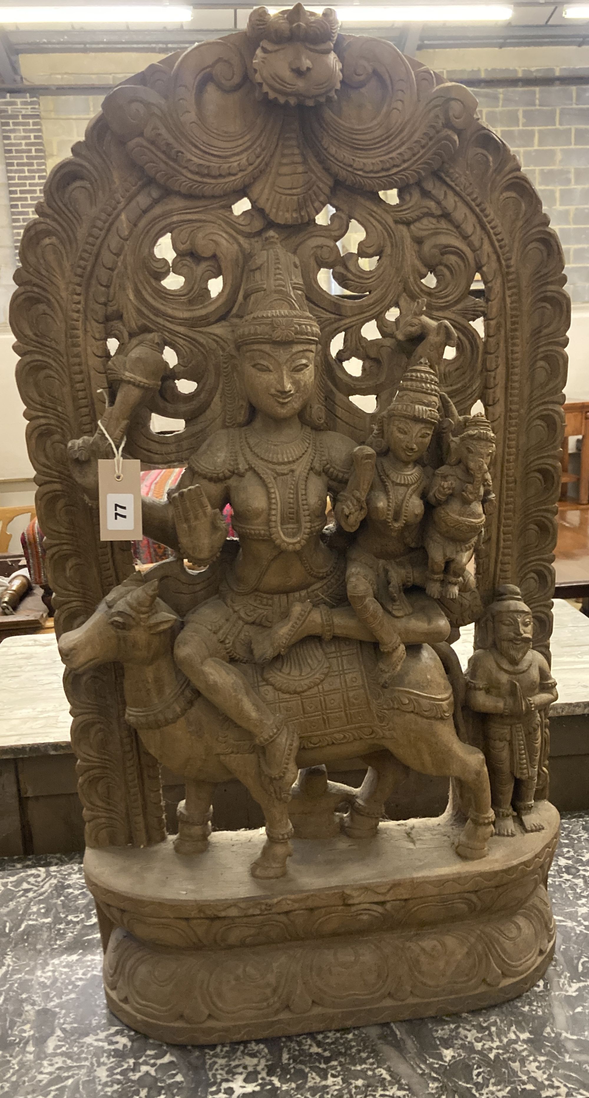 An Indian carved wood deity, width 50cm, depth 15cm, height 90cm